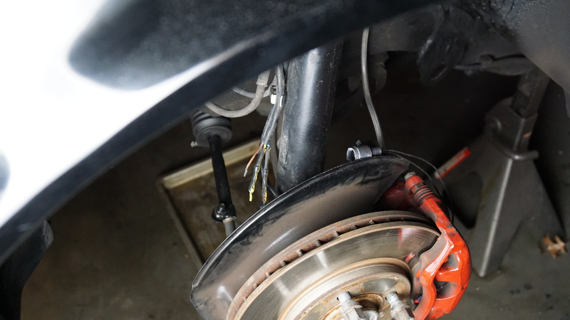 These three severed wires are for the front brake pad sensor. I installed a new waterproof connector to rejoin the wires. Of course, I forgot to grab a picture of the finished product but it does work now.